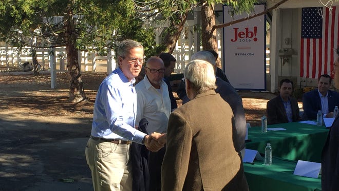 Republican presidential hopeful Jeb Bush greets a panel Oct. 21 at a roundtable discussion at Rancho San Rafael Regional Park in Reno.
