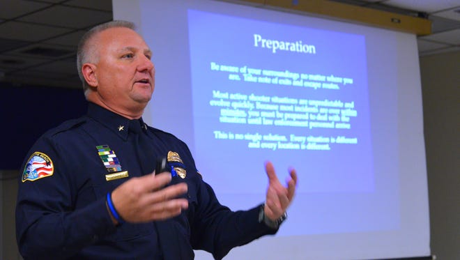 Commandaer Brad Hodge discusses preparation for an emergency situation. On Wednesday night Satellite Beach Police Chief Jeff Pearson and Commander Brad Hodge held a presentation for concerned citizens and parents to explain Satellite Beach police department's  training, preparation and response for an active shooter situation. 