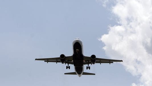 A passenger jet approaches Newark Liberty International Airport for a landing.
