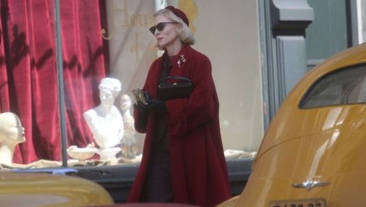 Oscar-winning actress Cate Blanchett walks down Fourth Street during the filming of the movie "Carol" on the corner of 4th Street and Central Avenue in downtown Cincinnati.