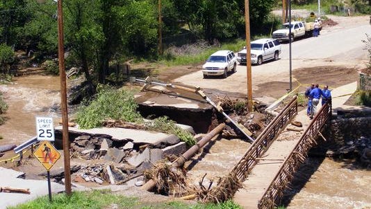 The bridge and road across the Rio Ruidoso at Eagle Drive was one of 13 bridges destroyed or damaged in 2008. It is the only one replaced with a span-type design to withstand future flooding. Close Bridge is next on the list.