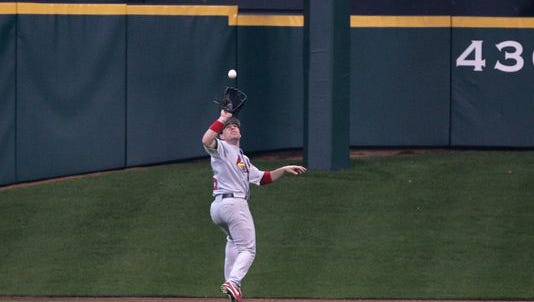 Jim Edmonds of the St. Louis Cardinals catches a ball deep out in center field neat Tal's Hill.