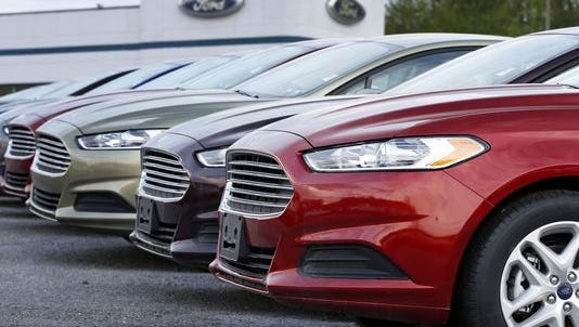 A row of new Ford Fusions lines a dealership in Zelienople, Pa.