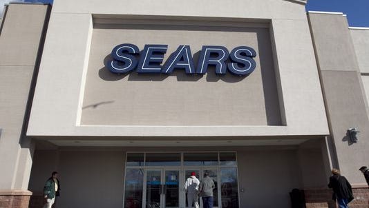Shoppers enter a Sears department store.