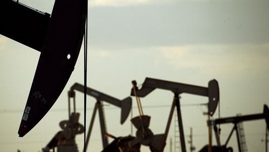 This file photo taken in 2015 shows oil pumpjacks working in a field near Lovington.