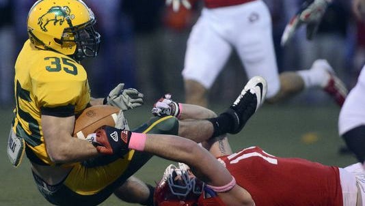 NDSU’s Christian Dudzik (35) hits the deck during a game against USD at Howard Wood Field in 2012. The Bison have new faces but are still No. 1.