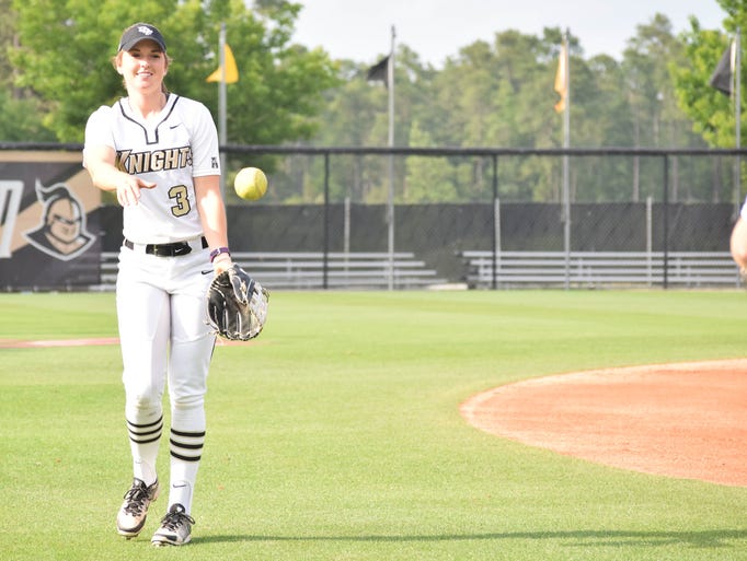 UCF outfielder Andrea Neswiacheny warms up with a teammate