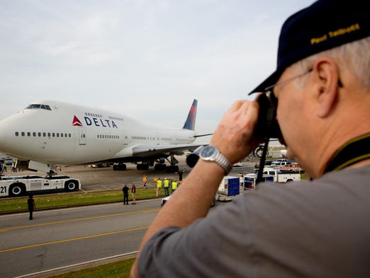 Locals snap photos as Delta Air Lines moves the first
