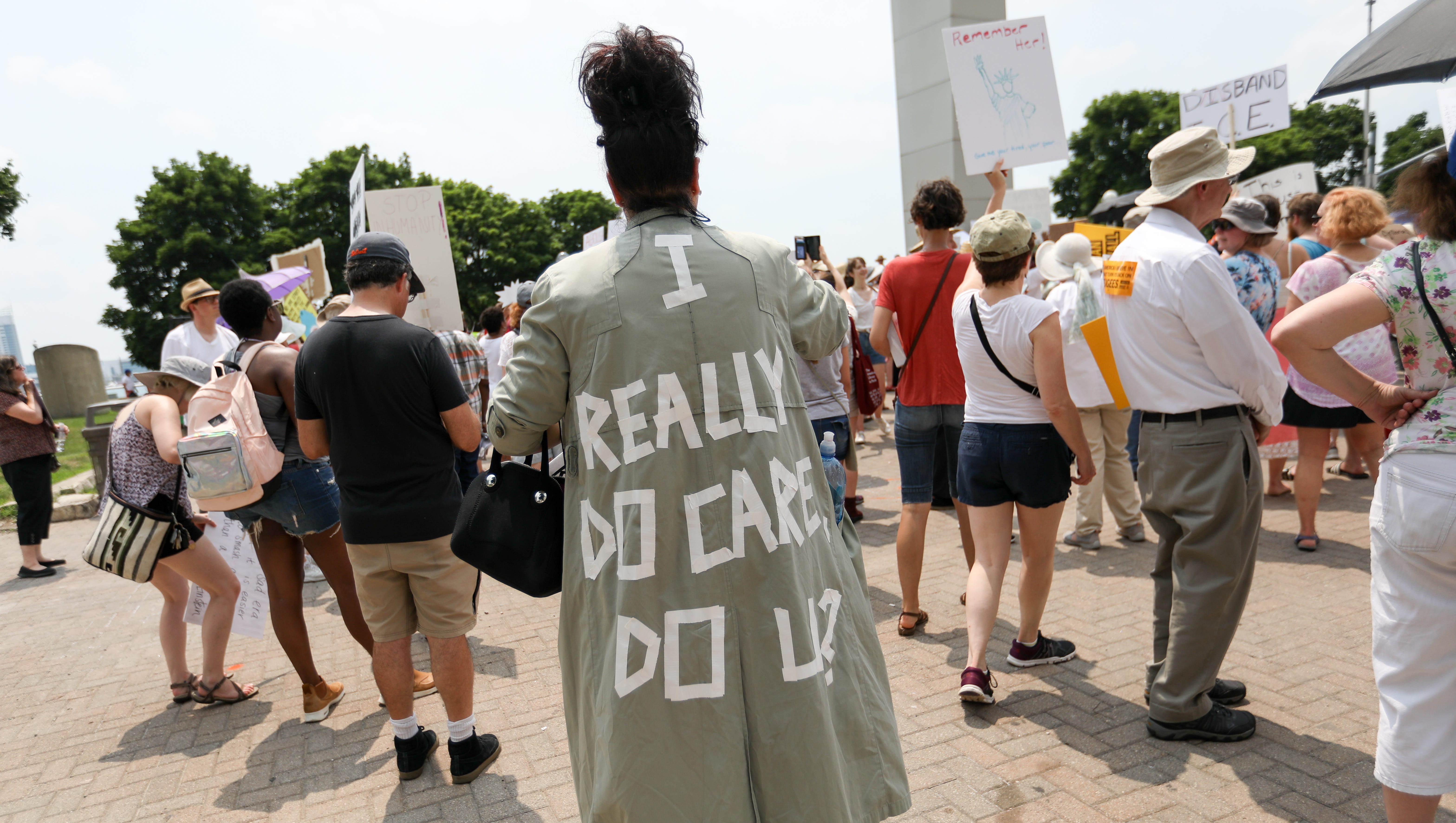 People regroup at Hart Plaza after marching during