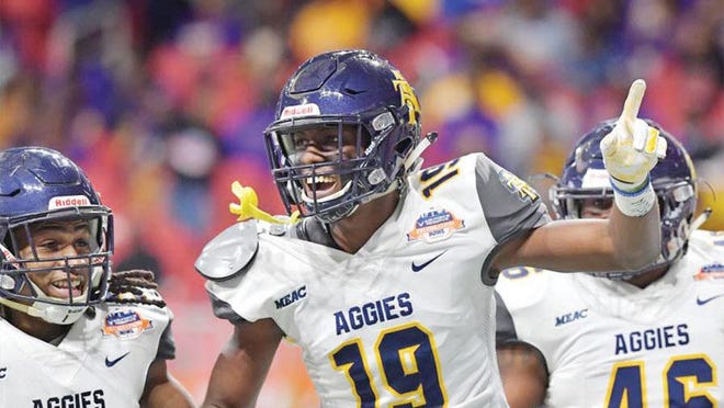 N.C. A&T receiver Zachary Leslie (19) celebrates after he scored a touchdown during the first half of the 2018 Celebration Bowl.