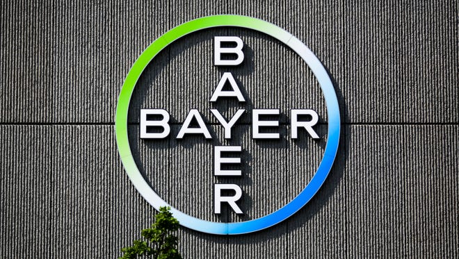 The Bayer AG corporate logo is displayed on a building of the German drug and chemicals company in Berlin, Germany, Monday, May 23, 2016.