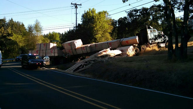 A crash that took place on Delaney Road SE near Battlecreek Road SE Wednesday morning is slowing traffic in the area as crews worked to clear spilled lumber.