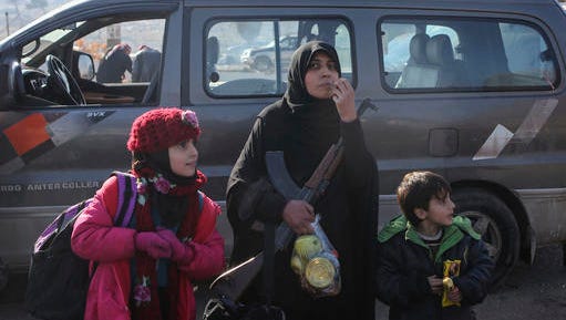 Syrians evacuated from the embattled Syrian city of Aleppo during the ceasefire arrive at a refugee camp in Rashidin, near Idlib, Syria, Tuesday, Dec. 20, 2016. Russian Foreign Minister Sergey Lavrov said on Tuesday that Russia, Iran and Turkey are ready to act as guarantors in a peace deal between the Syrian government and the opposition. He spoke on Tuesday after a meeting of the three countries' foreign ministers in Moscow.
