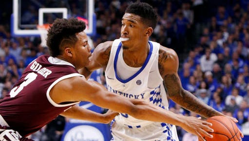Kentucky's Malik Monk, right, looks for an opening on Texas A&M's Admon Gilder (3) during the second half of an NCAA college basketball game, Tuesday, Jan. 3, 2017, in Lexington, Ky. Kentucky won 100-58. (AP Photo/James Crisp)