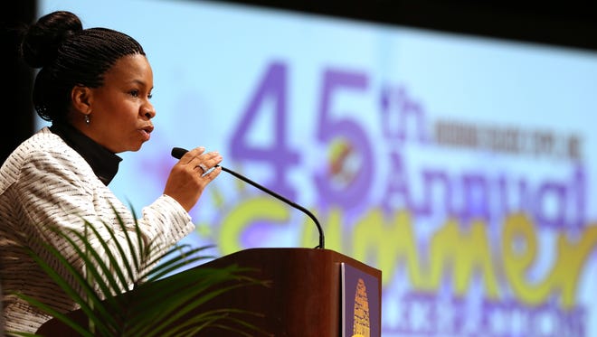 Tanya Bell, president and CEO Indiana Black Expo, Inc., welcomes about 350 people to the 45th Annual Indiana Black Expo Summer Celebration's Mayor's Breakfast in the Sagamore Ballroom at the Indiana Convention Center on Monday, July 13, 2015. Indianapolis Mayor Greg Ballard gave the keynote address, "Gaining the Edge,Ó at the event.