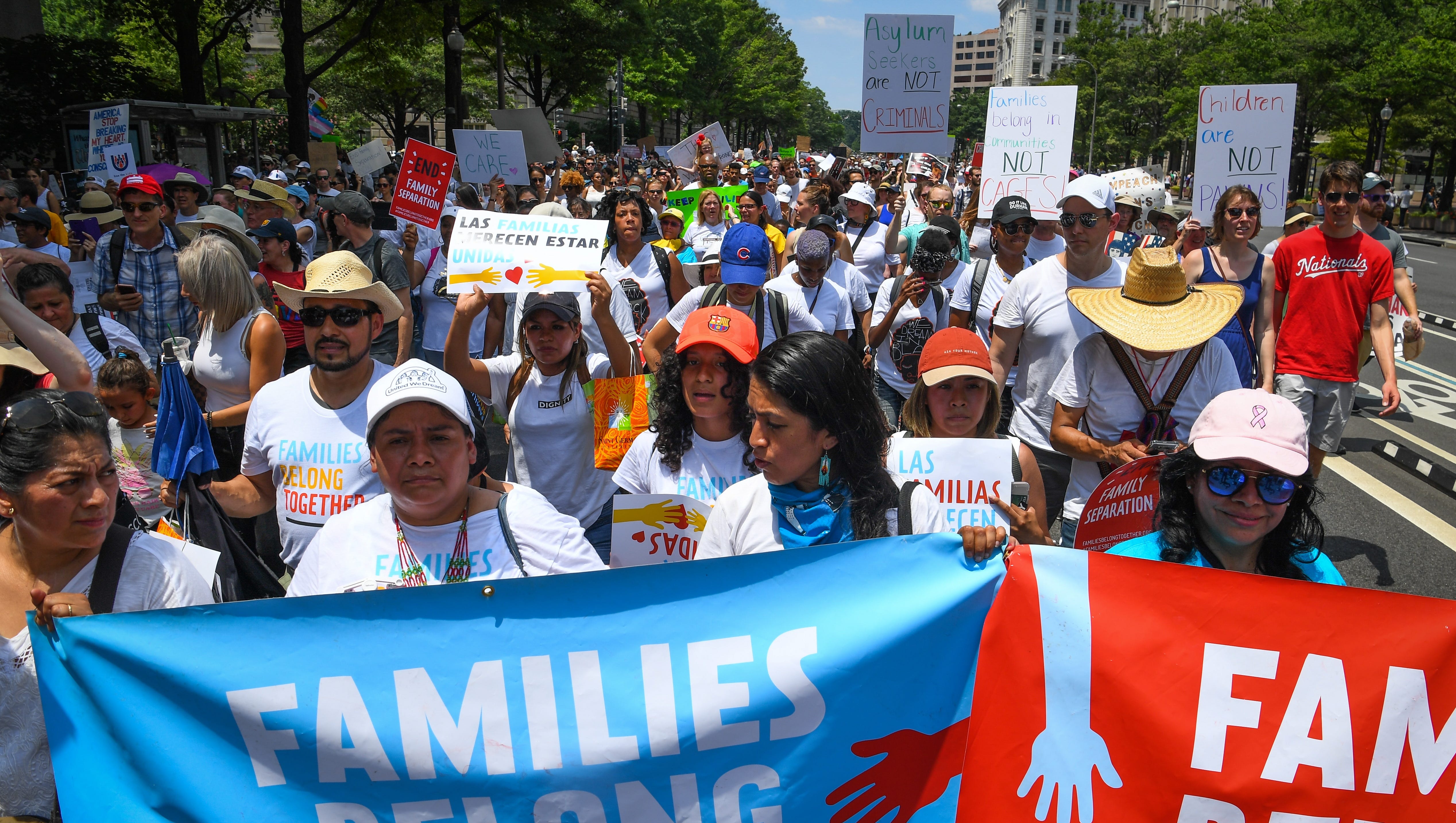 Protesters march during the Families Belong Together