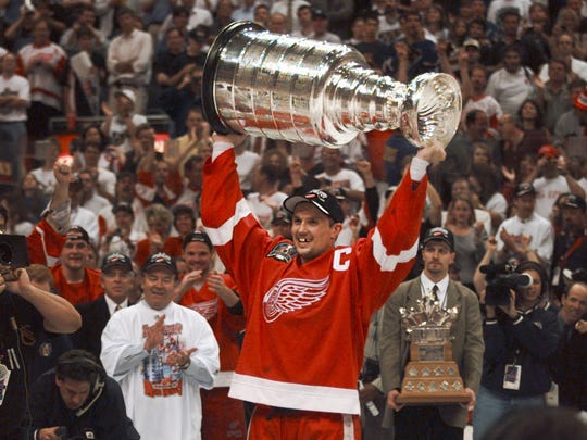 Red Wings captain Steve Yzerman holds the Stanley Cup
