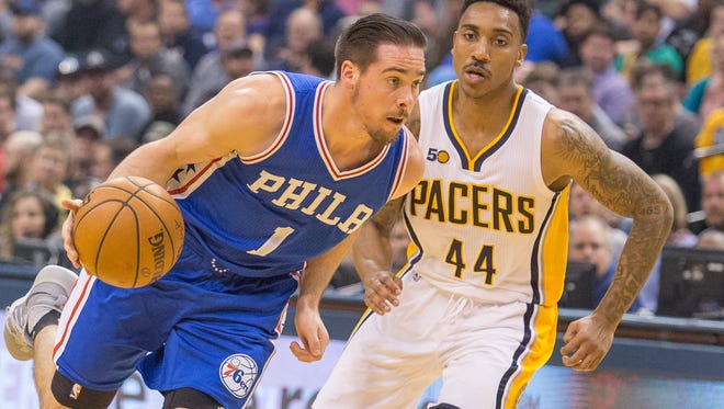 Philadelphia 76ers guard TJ McConnell (1) dribbles the ball while Indiana Pacers guard Jeff Teague (44) defends during a game from last season. The 76ers picked up the option on McConnell's contract for next season.