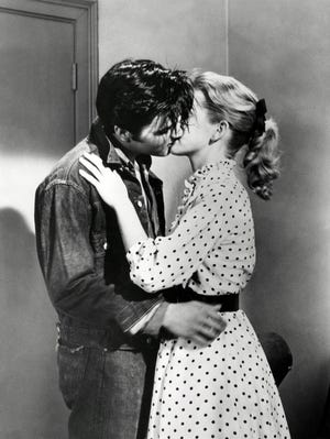 Elvis Presley and Dolores Hart share a kiss in "Loving You." Six years later, she became cloistered nun.