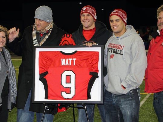 Pewaukee High School honored J.J. Watt by retiring his No. 9 Pirates jersey Oct. 25, 2013, during the program's varsity playoff game against Elkhorn. Among those on hand were (from left) mom Connie, J.J., brothers T.J. and Derek and father John.