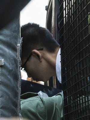 Joshua Wong leaves a prison van after arriving at the Court of Final Appeal for his bail application at Hong Kong's highest court on Oct. 24, 2017.