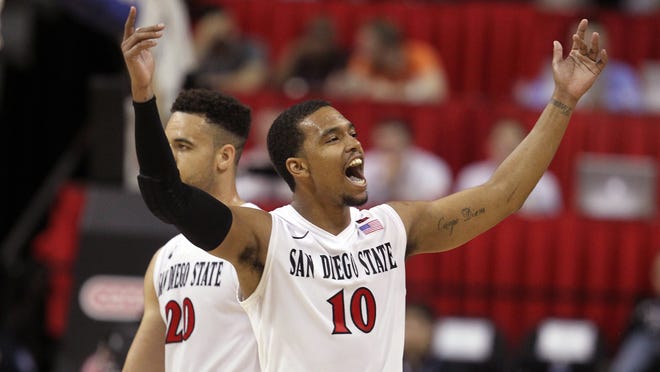 San Diego State’s Aqeel Quinn reacts in the final seconds of the Aztecs’ 67-65 win over Wyoming on Thursday night in the Mountain West tournament in Las Vegas. San Diego State faces CSU in the semifinals Friday night.