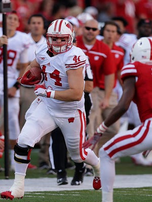 Badgers tight end Eric Steffes picks up a first down in the first half during Wisconsin's 23-21win over Nebraska.