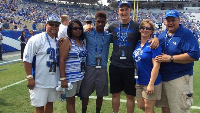 From left, 2016 UK commits Davonte Robinson and Landon Young, and their families