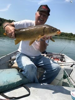 Author with 10-pound carp caught and released at Spruce Run Reservoir on board the Gone Fishin' V on July 31.
