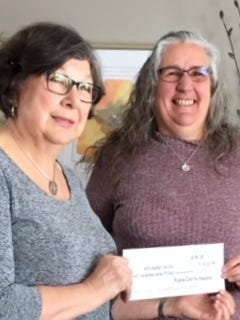 Arlene Danielson, president of the Fond du Lac ADK Organization presents check to Sue Reich, key volunteer with Whisper Hill Therapy Clydesdales.