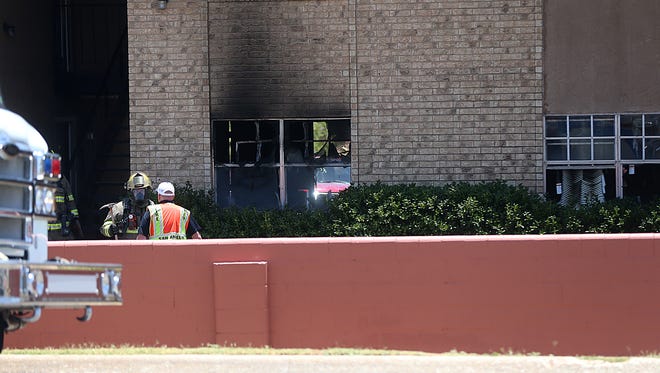 Officials with the San Angelo Fire Department and San Angelo Police Department investigate an fire at the Arden Ridge Apartments that claimed one life in the 3800 block of Arden Road, July 2, 2018.