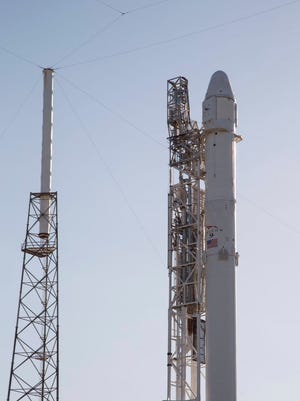 A Falcon 9 rocket and Dragon spacecraft on their Launch Complex 40 pad Tuesday at Cape Canaveral Air Force Station.