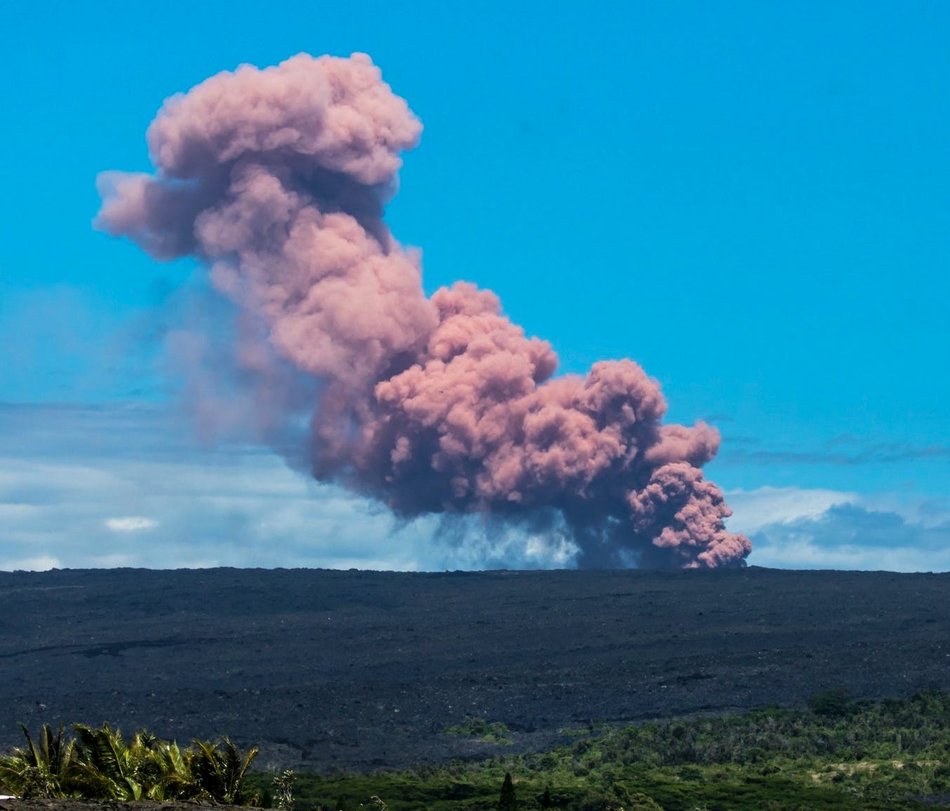 In this photo provided by Janice Wei, an ash plume rises above the Kilauea volcano on Hawaii's Big Island on May 3, 2018.