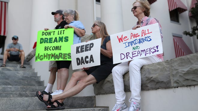 Dozens of people rally in support of Deferred Action for Childhood Arrivals, known as DACA, outside of the Capitol Tuesday, Sept. 5, 2017.
