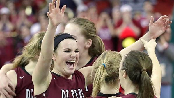 De Pere Annie Schneider cheers as the Redbirds win in overtime against Middleton in a WIAA Division 1 Girls State Basketball semifinal at the Resch Center in Ashwaubenon Friday.