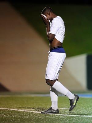 Abilene High's Blaise Kapinga (12) reacts after missing a penalty kick in the Eagles' loss to Arlington Lamar in the Region I-6A bi-district playoff on Friday, March 24, 2017, at Shotwell Stadium. 