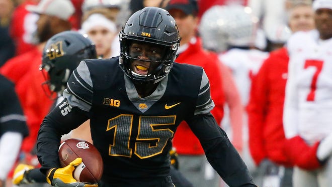 Iowa defensive back Josh Jackson returns an interception during a game against Ohio St.ate.