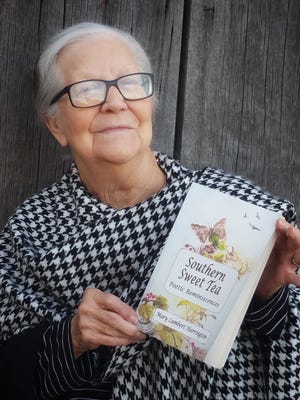 Mary Lambert Harrington was born in Tallahassee in 1929. She holds a copy of her first book, recently published, "Southern Sweet Tea: Poetic Reminiscences."