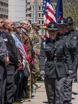 The Michigan Department of Corrections color guard retires the colors at the Fallen Officers Memorial Dedication Sunday, May 7, 2017.