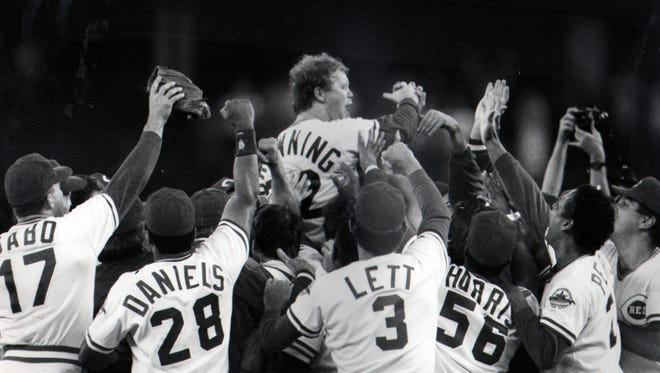 The Reds sweep pitcher Tom Browning off his feet after striking out the Dodgers' Tracy Woodson for the final out of his 1-0 perfect game on Sept. 16, 1988.