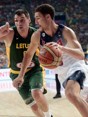 USA guard Klay Thompson drives past Lithuania's Jonas Maciulis during the FIBA World Cup semifinals.