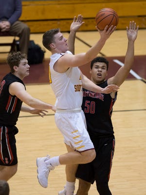 Gibson Southern’s Wes Obermeier (40) shoots against Southridge's Jaden Hayes (50) during their game on Feb. 1, 2018. Obermeier recently became the second player in school history to score 1,000 career points.