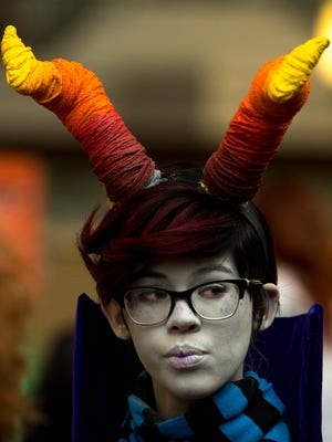 Ava Herron, 15, of Henderson, Ky., cosplays Eridan Ampura from "Homestuck" at EvilleCon 2018 at the Holiday Inn Evansville Airport Hotel Friday. The event continues through the weekend.