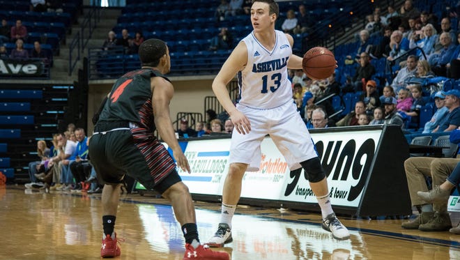 UNC Asheville senior guard David Robertson (13), shown in action last month, led the Bulldogs with 23 points against Campbell.