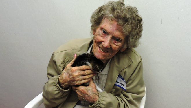 The best part of a kitten shower? Snuggling a little one, as 94-year old Charlotte Marical attests.