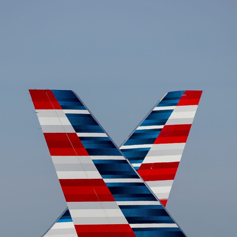 Two American Airlines Boeing 757s pass one another at Chicago O'Hare International Airport in June 2015.