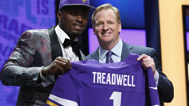 Laquon Treadwell (Mississippi) stands with NFL Commissioner Roger Goodell after being selected by the Minnesota Vikings as the No. 23 overall pick in the first round of the 2016 NFL Draft at Auditorium Theatre in Chicago.