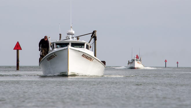 The Henrietta C heads back to Tangier Island from oystering on the Chesapeake Bay. The boat sank Monday, April 24, about 5 miles off the island
