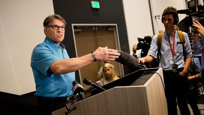 U.S. Secretary of Energy Rick Perry speaks to the press after touring the Daikin Texas Technology Park in Waller, Texas, on July 28, 2017.