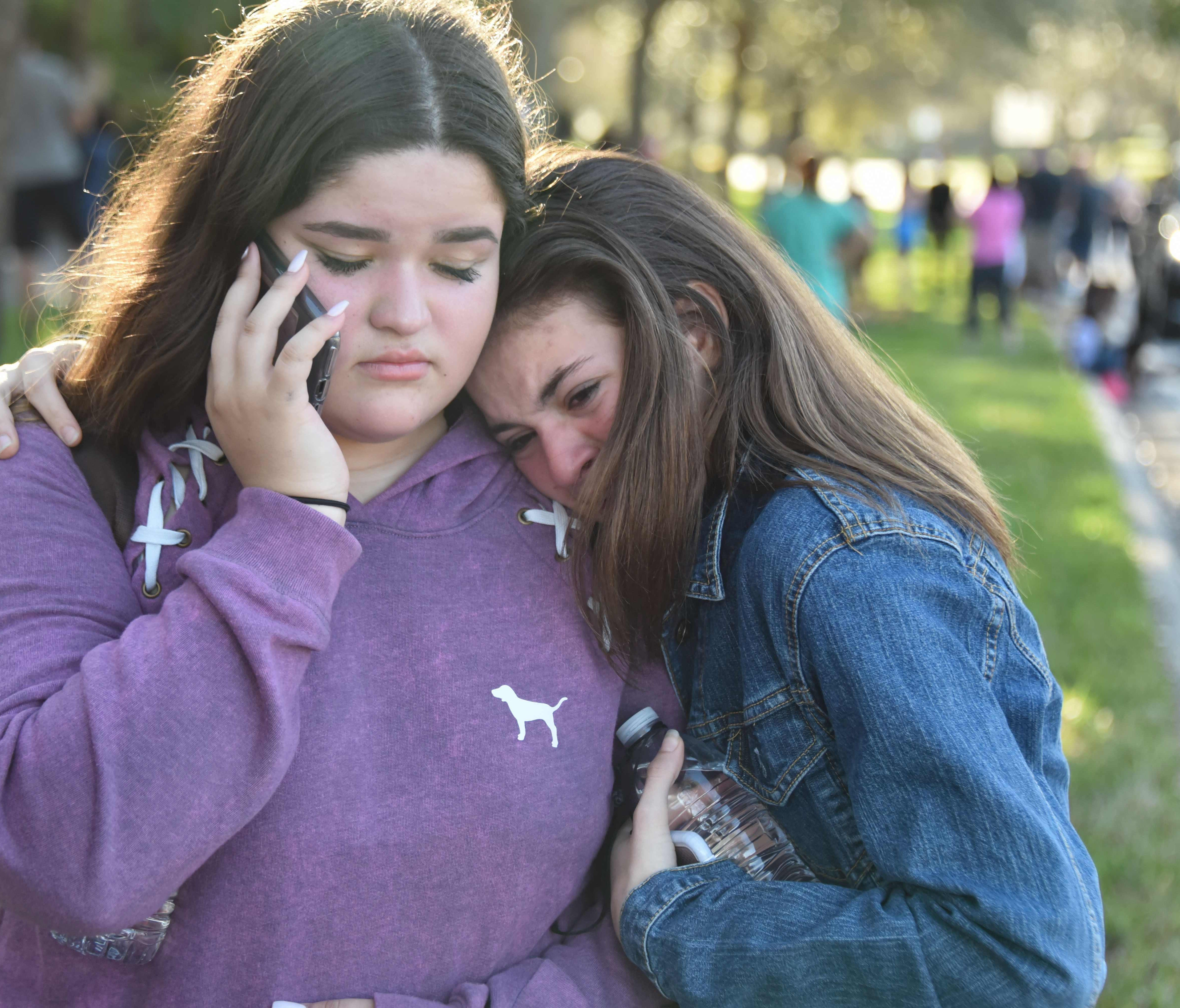 Students react following a shooting at Marjory Stoneman Douglas High School in Parkland, Fla., a city about 50 miles north of Miami.